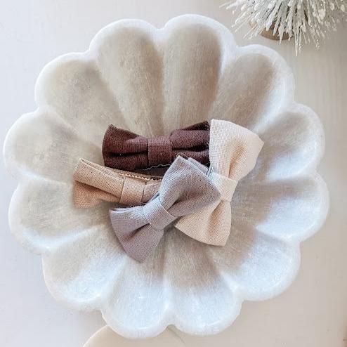 marble flower dish holding bows