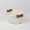 white basket with leather handles