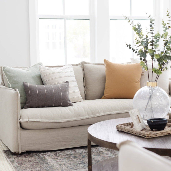 white sofa in a neutral, modern organic living room