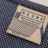 ME3MA label on a blue fabric placemat