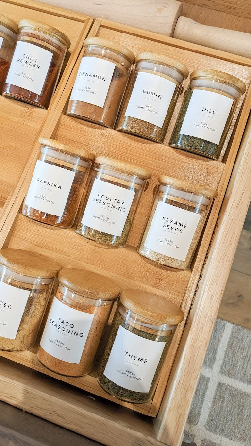 Organized spice jars in kitchen drawer