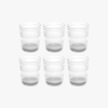 Set of six clear acrylic tumblers with textured design on a white background