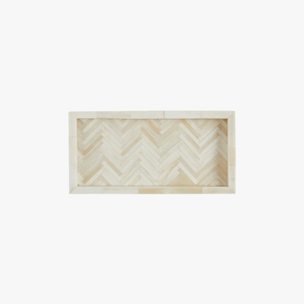 Rectangular wooden tray with a herringbone pattern on a white background