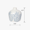 White vase with blue patterns and measurements on a white background