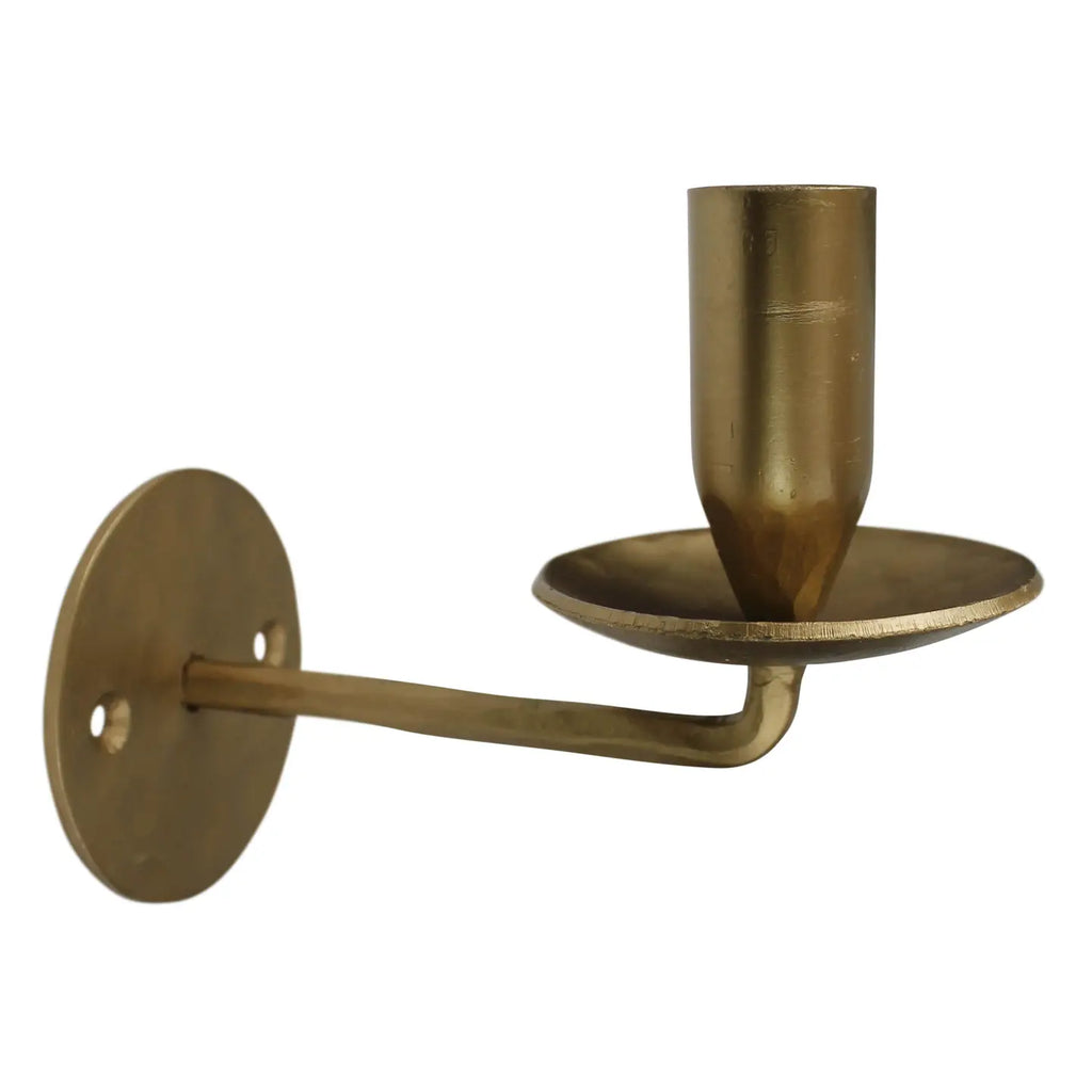Brass wall-mounted candle holder on a white background