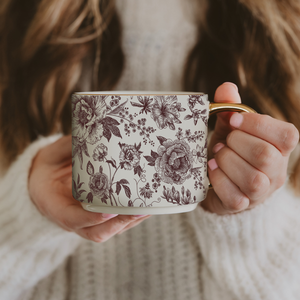 Woman holding Brown Floral Coffee Mug