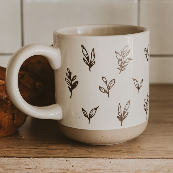 Brown Leaves Stoneware Coffee Mug on kitchen counter