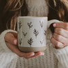 Woman holding a Brown Leaves Stoneware Coffee Mug