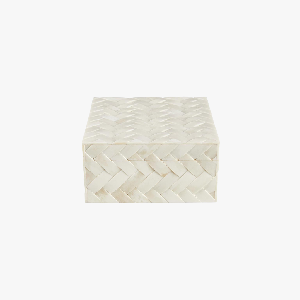 Decorative box with woven pattern on a white background