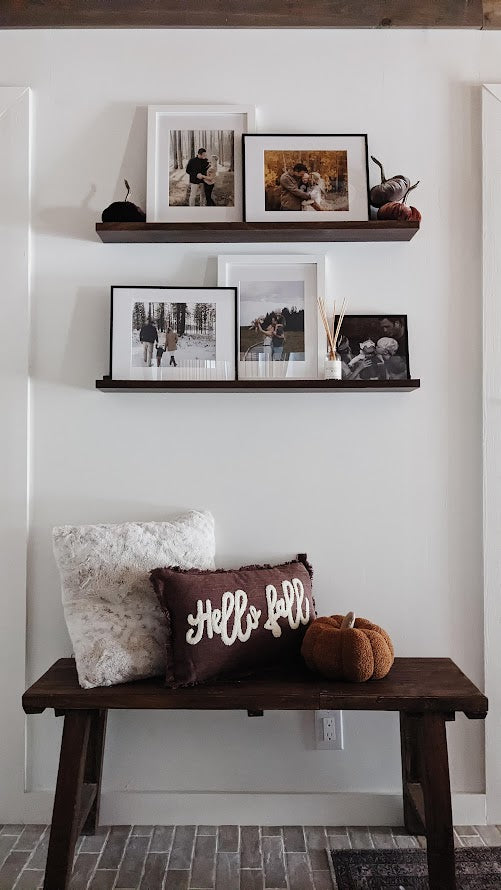 Entryway with fall pillow and pumpkin throw pillow