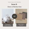 A product selection graphic for the Modern Harvest Fall Abode Box, showing a choice between a Stoneware Garlic Keeper and a Dish Cloth set of 3. The left panel displays a white ceramic garlic keeper with ventilation holes on a neutral background.