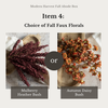A product selection graphic for a 'Modern Harvest Fall Abode Box' showing two options for fall faux florals: 'Mulberry Heather Bush' with dark burgundy dried flowers on the left, and 'Autumn Daisy Bush' with orange-brown dried flowers on the right, separated by a central 'or' badge.