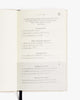 Open notebook with text on a white background