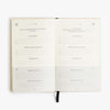 Open notebook with lined pages on a white background