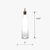 Clear glass bottle with wooden cap and measurements on a white background