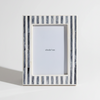 grey and white Striped photo frame with 'abode box' branding on a white background