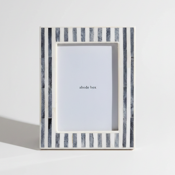 grey and white Striped photo frame with 'abode box' branding on a white background