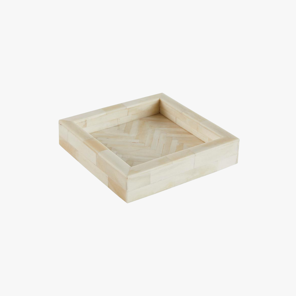 Square wooden tray with a herringbone pattern on a white background