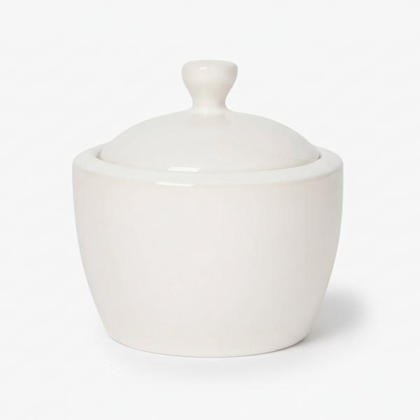 White ceramic lidded sugar jar on a white background