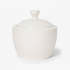 White ceramic lidded sugar jar on a white background