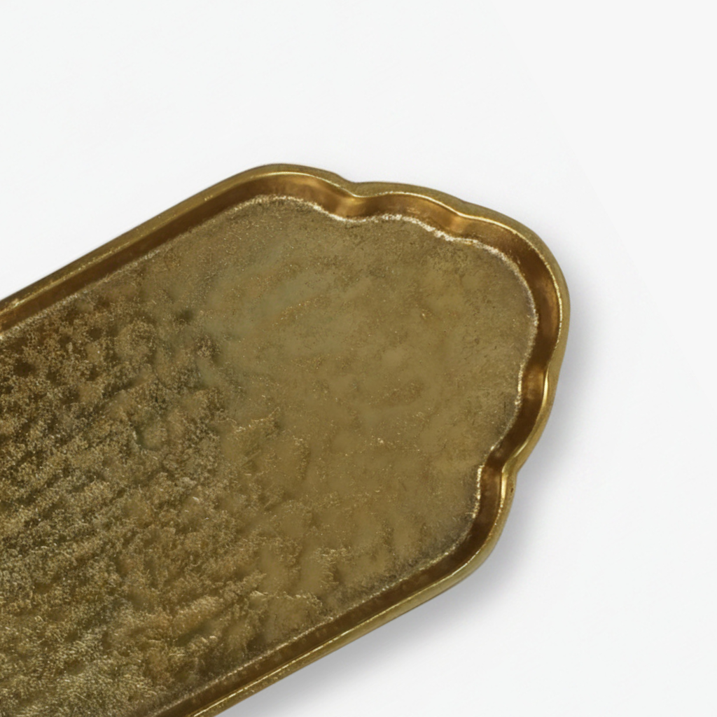 Brass metal tray on a white background_quiet luxury home decor
