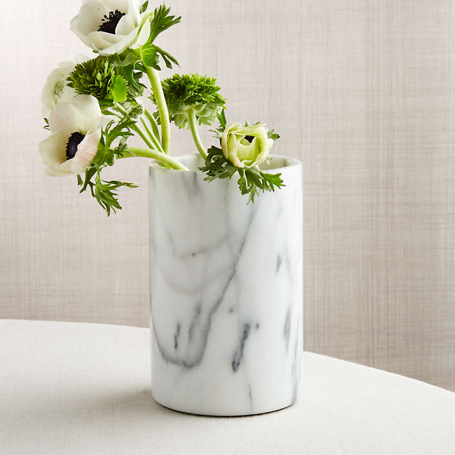 Marble-patterned vase with flowers on a neutral background