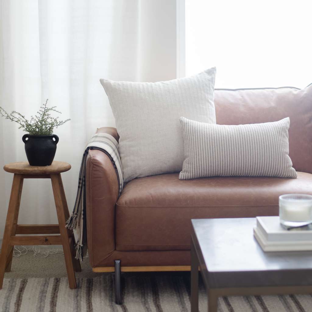 Neutral Cream Pillow Cover on Leather Couch