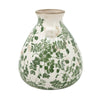 Decorative vase with green floral pattern on a white background