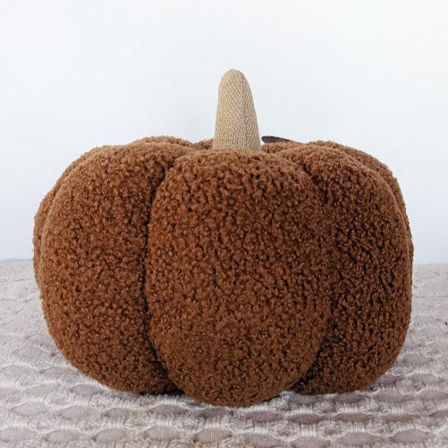 sherpa pumpkin pillow in a rust color