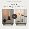 Two forged iron wall sconces, one black and one antique brass, with 'SOLD OUT!' text overlay.