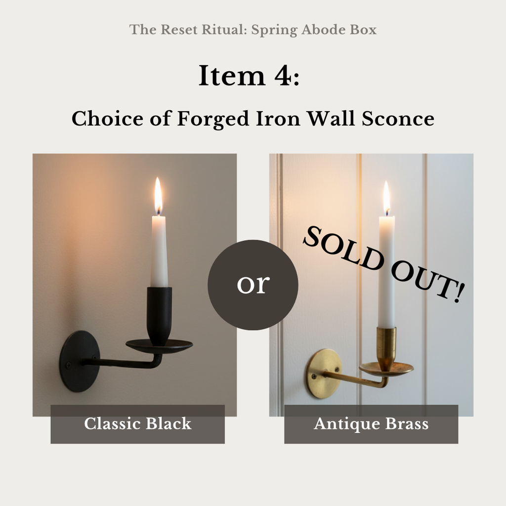 Two forged iron wall sconces, one black and one antique brass, with 'SOLD OUT!' text overlay.