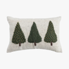 Decorative pillow with three green trees on a white background