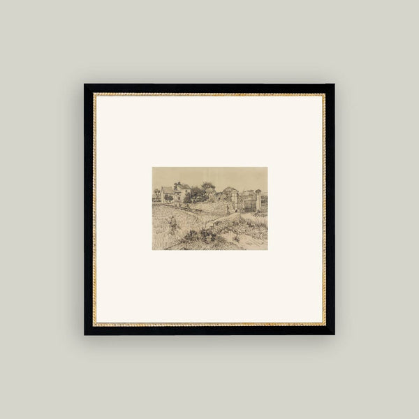 Framed artwork of a landscape with a black frame on a light gray wall