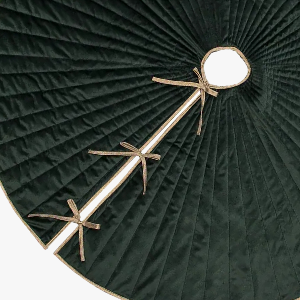 Dark green pleated skirt with gold decorative elements on a white background