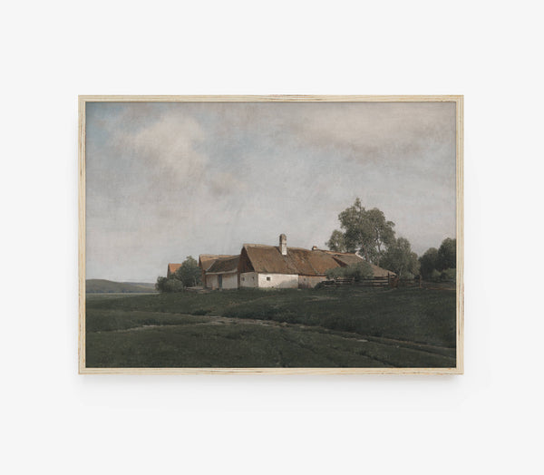 A framed landscape painting depicting a rural scene with a small white farmhouse, brown roof, green fields, and trees under a cloudy sky, shown against a light gray background.