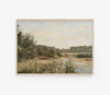 Framed landscape painting of a field with trees and sky.