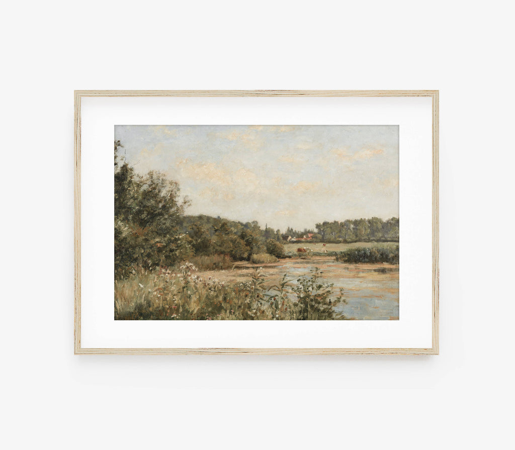 Framed landscape painting on a white wall