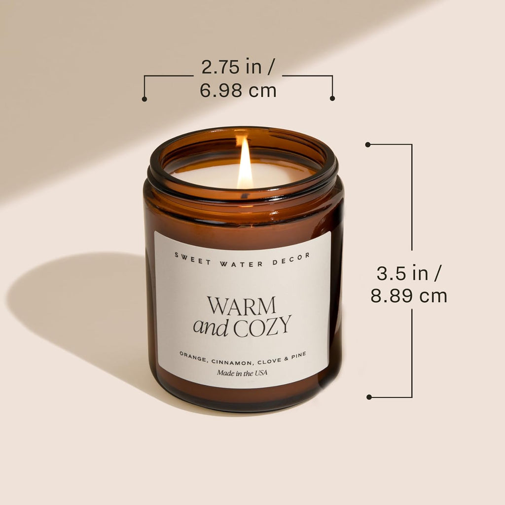 Candle in a glass jar with dimensions labeled on a beige background