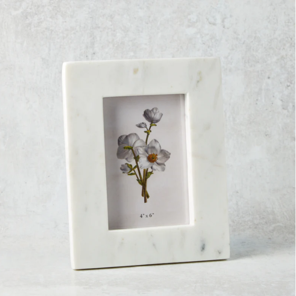 Marble-framed picture with floral illustration on a textured white background