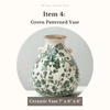 Ceramic vase with green patterns on a white background