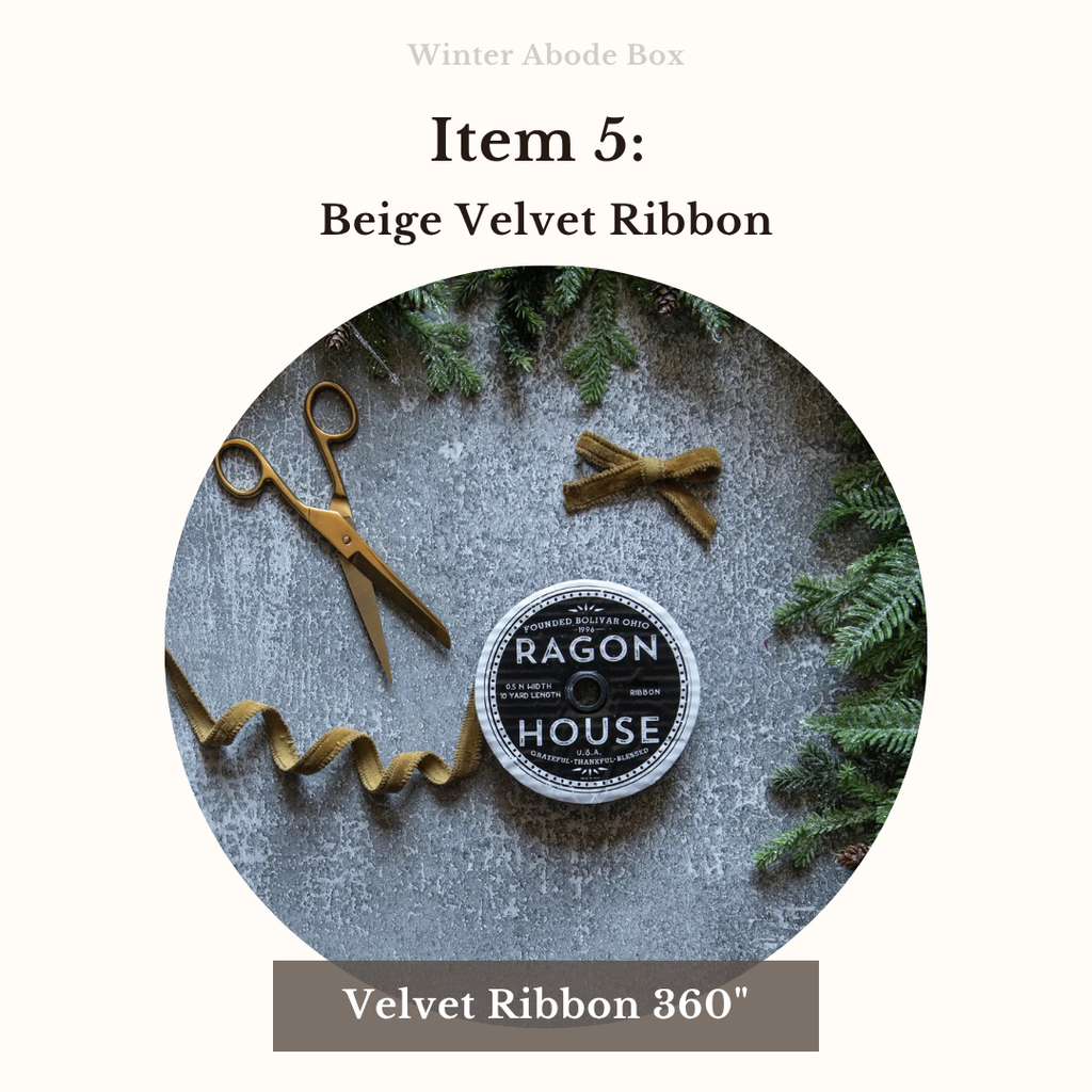 Beige velvet ribbon with scissors and a label on a textured surface with greenery.