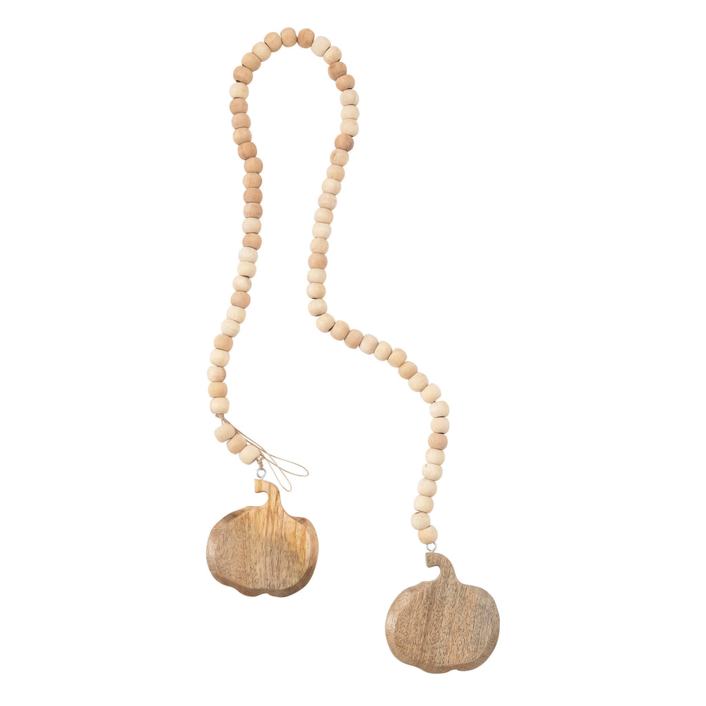 Necklace with beige beads and wooden pendants on a white background