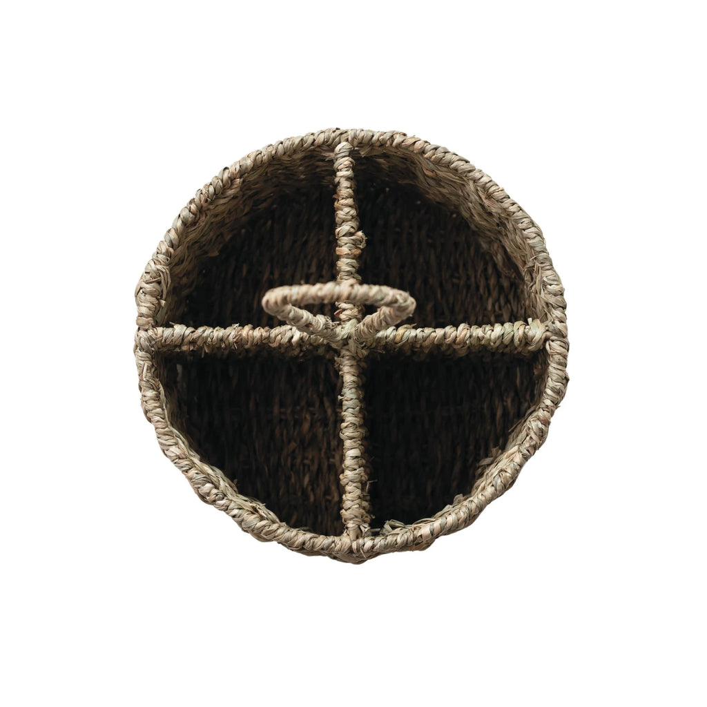 Woven utensil caddy with a central handle on a white background