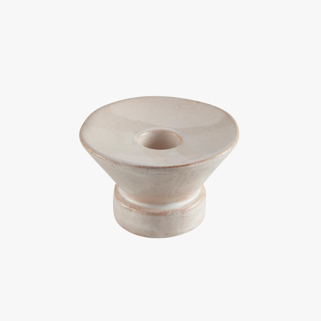 White stoneware candle holder on a white background