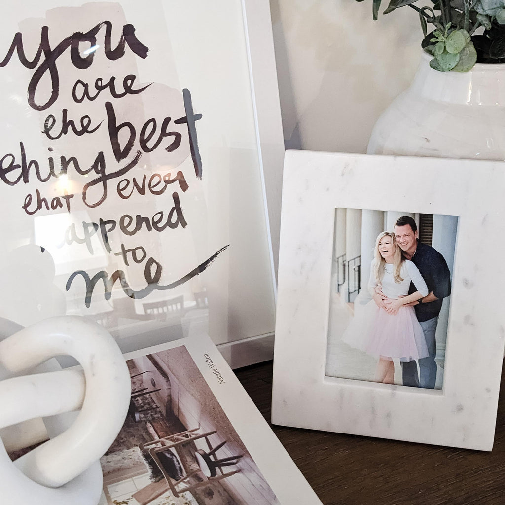 marble frame on bookshelf