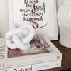 marble knot on coffee table books