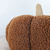 close up of a sherpa pumpkin pillow