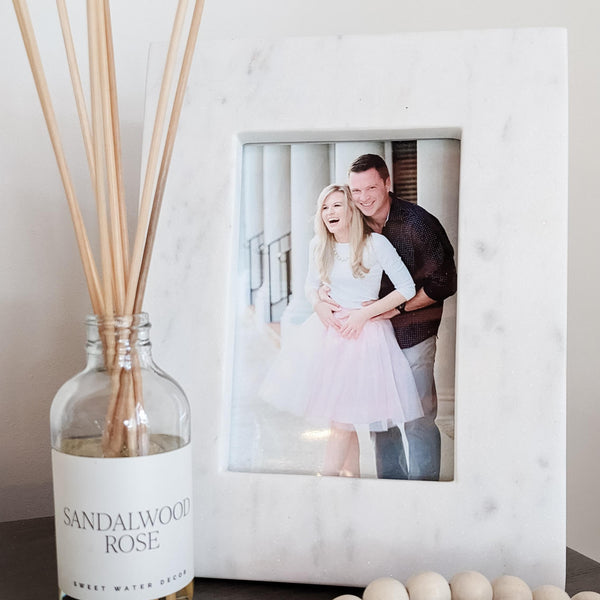 white marble frame on console table