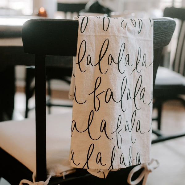 Christmas Tea Towel hanging on black chair in kitchen
