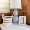 Cream_Stripe_Storage_Basket on bedroom dresser with accessories